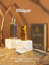 MIZIYAN fragrance oil bottles with gold cap and dark bottle, displayed with gift box