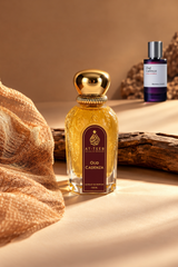 Gold glass perfume bottle with metallic cap and label, 100ml