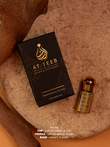 MUSHK-E-TAHARA fragrance oil box and small bottle with gold cap and speckled print