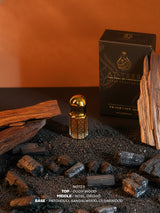 OUDH ROYAL fragrance oil bottle with gold cap beside fragrance box and wooden sticks