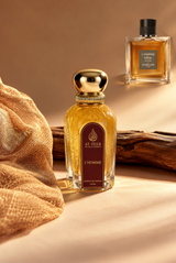 L'HOMME eau de parfum spray bottle, gold cap and amber glass
