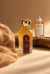 Perfume bottle with gold cap and amber glass, red label reading FIRE PALACE.