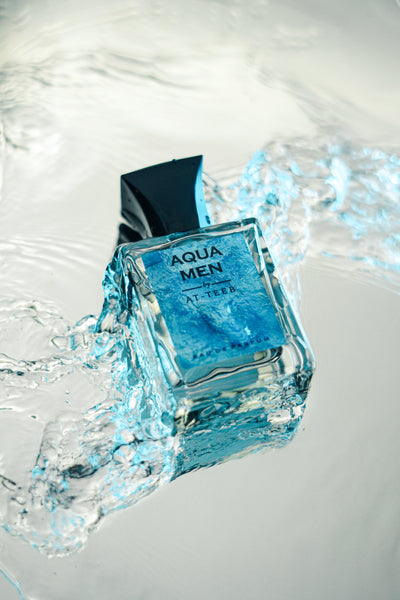 AQUA MEN men's fragrance bottle with teal label and water splash
