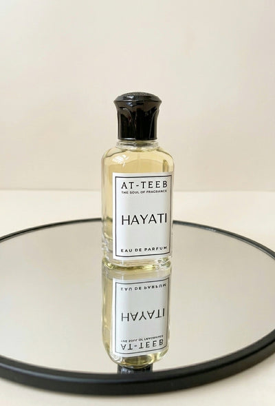 HAYATI eau de parfum bottle, clear glass with black cap and white label